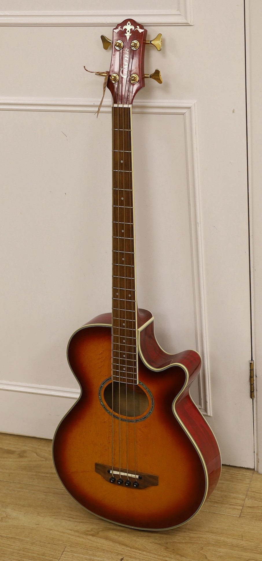 A Crafter electro-acoustic bass guitar. Model No. BA-600EQ/AMS-P Serial No. 00202718, 113cms high.